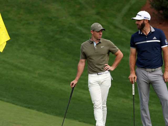 AUGUSTA, GEORGIA - NOVEMBER 13: Rory McIlroy of Northern Ireland stands with Dustin Johnson of the United States on the 10th green during the second round of the Masters at Augusta National Golf Club on November 13, 2020 in Augusta, Georgia.