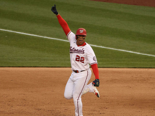 Washington Nationals center fielder Juan Soto (22) smiles in the