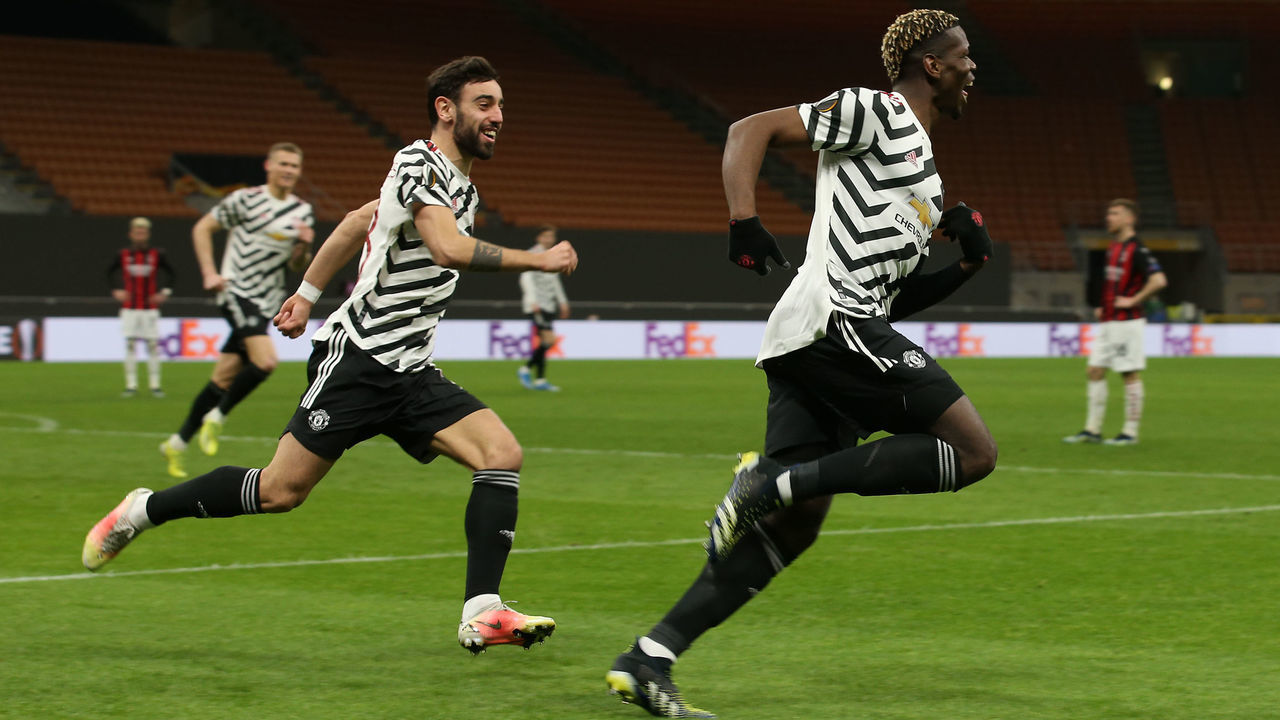 MILAN, ITALY - MARCH 18: Paul Pogba of Manchester United celebrates scoring their first goal during the UEFA Europa League Round of 16 Second Leg match between AC Milan and Manchester United at San Siro on March 18, 2021 in Milan, Italy. Sporting stadiums around Europe remain under strict restrictions due to the Coronavirus Pandemic as Government social distancing laws prohibit fans inside venues resulting in games being played behind closed doors.