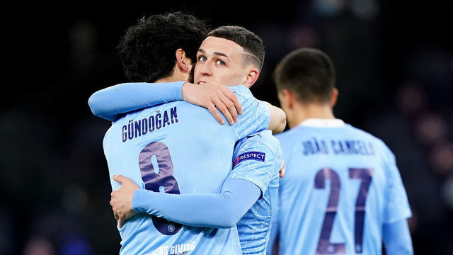 MANCHESTER, ENGLAND - APRIL 06: Phil Foden of Manchester City celebrates with team mates after scoring his teams second goal during the UEFA Champions League Quarter Final match between Manchester City and Borussia Dortmund at Manchester City Football Academy on April 06, 2021 in Manchester, England.