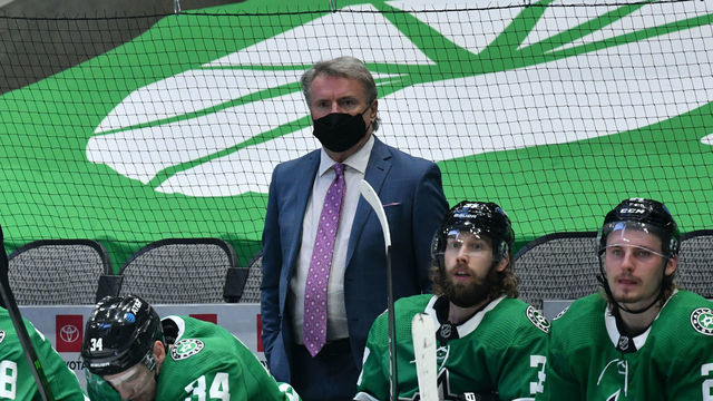 DALLAS, TX - MARCH 25: Rick Bowness of the Dallas Stars watches the action from behind the bench against the Tampa Bay Lightning at the American Airlines Center on March 25, 2021 in Dallas, Texas.