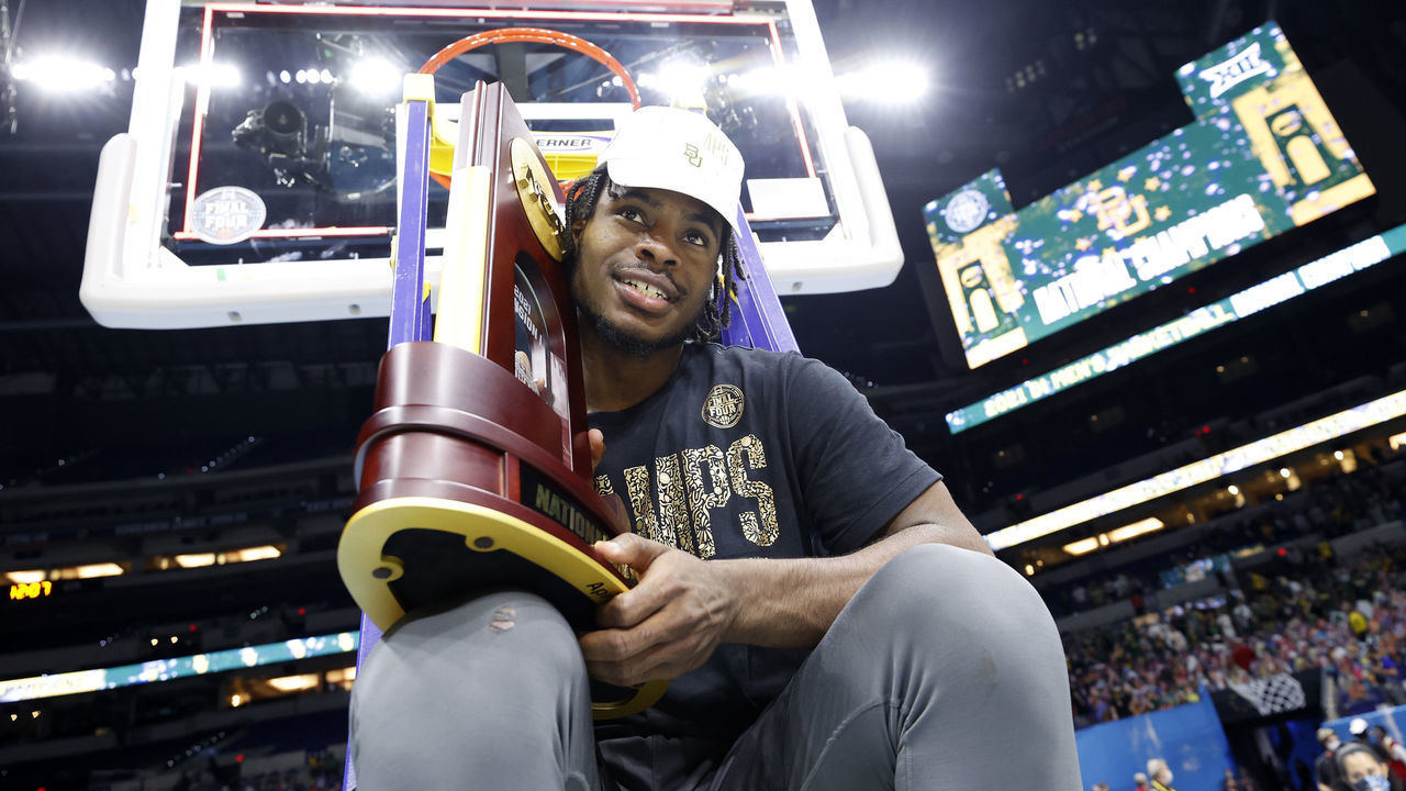 INDIANAPOLIS, INDIANA - APRIL 05: Davion Mitchell #45 of the Baylor Bears sits on a ladder with the trophy after defeating the Gonzaga Bulldogs in the National Championship game of the 2021 NCAA Men's Basketball Tournament at Lucas Oil Stadium on April 05, 2021 in Indianapolis, Indiana. The Baylor Bears defeated the Gonzaga Bulldogs 86-70.