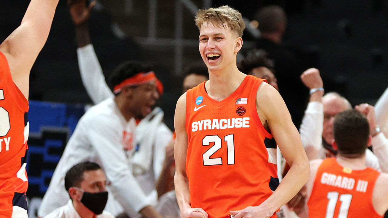INDIANAPOLIS, INDIANA - MARCH 21: Buddy Boeheim #35 and Marek Dolezaj #21 of the Syracuse Orange celebrate their win over the West Virginia Mountaineers in their second round game of the 2021 NCAA Men's Basketball Tournament at Bankers Life Fieldhouse on March 21, 2021 in Indianapolis, Indiana.