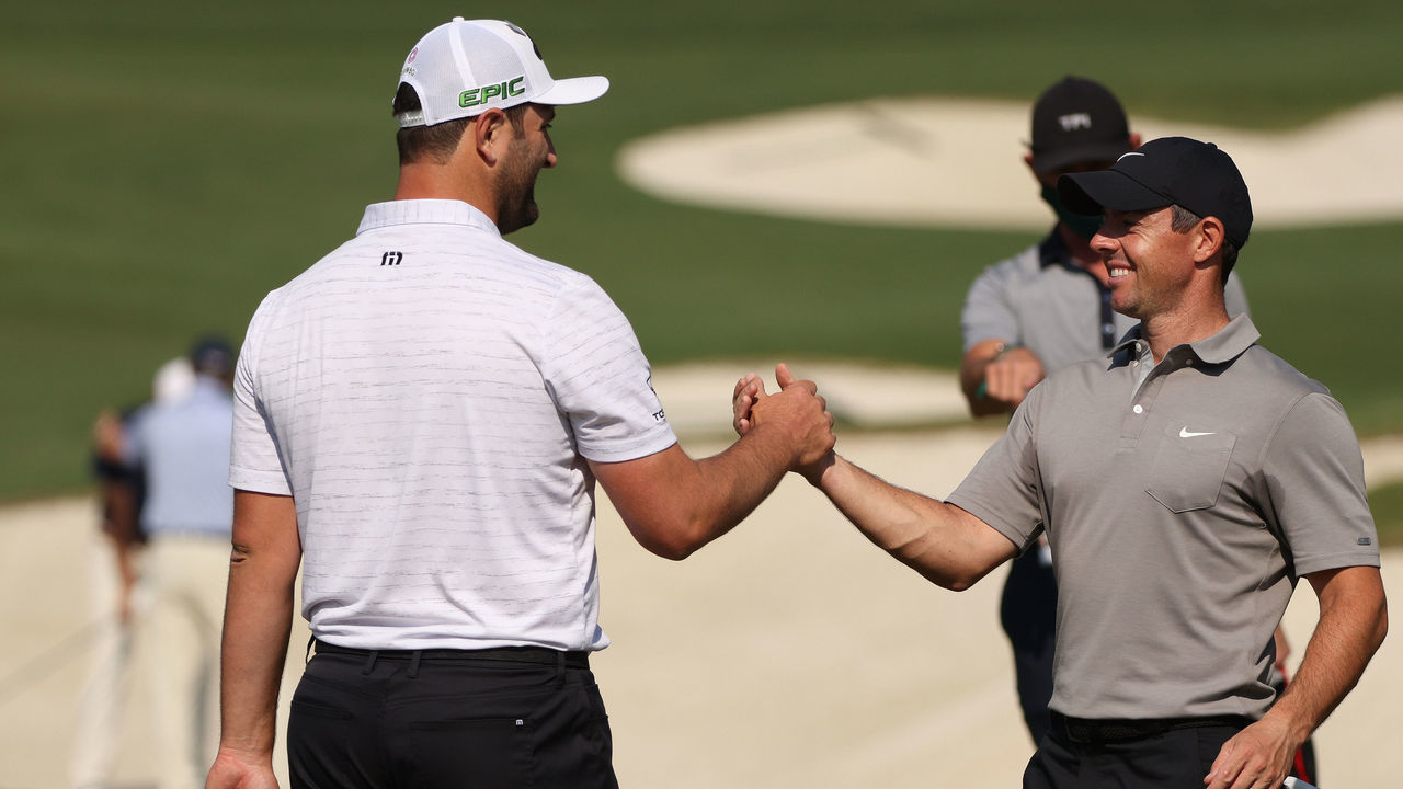 AUGUSTA, GEORGIA - APRIL 07: Jon Rahm of Spain greets Rory McIlroy of Northern Ireland on the range during a practice round prior to the Masters at Augusta National Golf Club on April 07, 2021 in Augusta, Georgia.