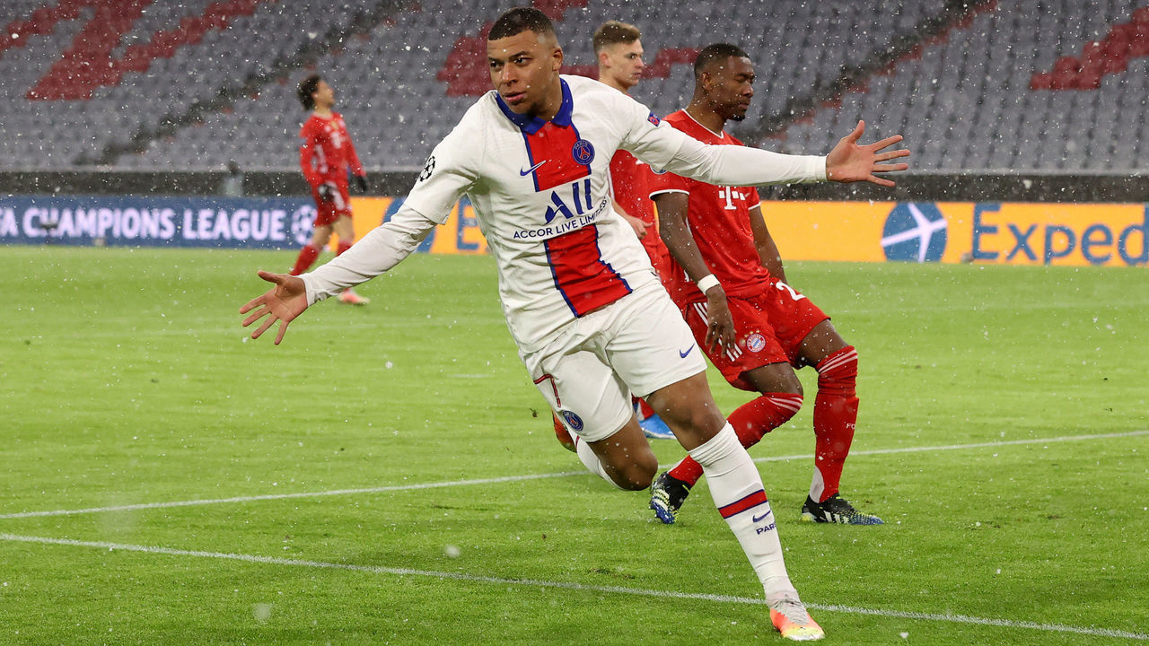 MUNICH, GERMANY - APRIL 07: Kylian Mbappe of Paris Saint-Germain celebrates after scoring their side's first goal during the UEFA Champions League Quarter Final match between FC Bayern Munich and Paris Saint-Germain at Allianz Arena on April 07, 2021 in Munich, Germany. Sporting stadiums around Germany remain under strict restrictions due to the Coronavirus Pandemic as Government social distancing laws prohibit fans inside venues resulting in games being played behind closed doors.