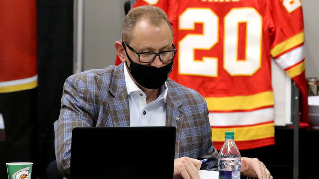 CALGARY, AB - OCTOBER 06: Vice President of Hockey Operations Don Maloney (L) and general manager Brad Treliving (C) attend the first round of the 2020 NHL Entry Draft at the Scotiabank Saddledome on October 06, 2020 in Calgary, Alberta, Canada. The 2020 NHL Draft was held virtually due to the ongoing coronavirus (COVID-19) pandemic.