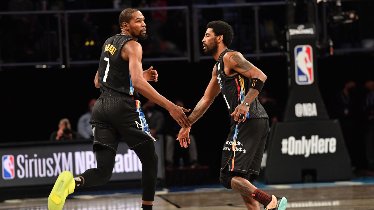 BROOKLYN, NY - APRIL 7: Kevin Durant #7 of the Brooklyn Nets and Kyrie Irving #11 of the Brooklyn Nets high-five during a game against the New Orleans Pelicans on April 7, 2021 at Barclays Center in Brooklyn, New York. NOTE TO USER: User expressly acknowledges and agrees that, by downloading and/or using this Photograph, user is consenting to the terms and conditions of the Getty Images License Agreement. Mandatory Copyright Notice: Copyright 2021 NBAE