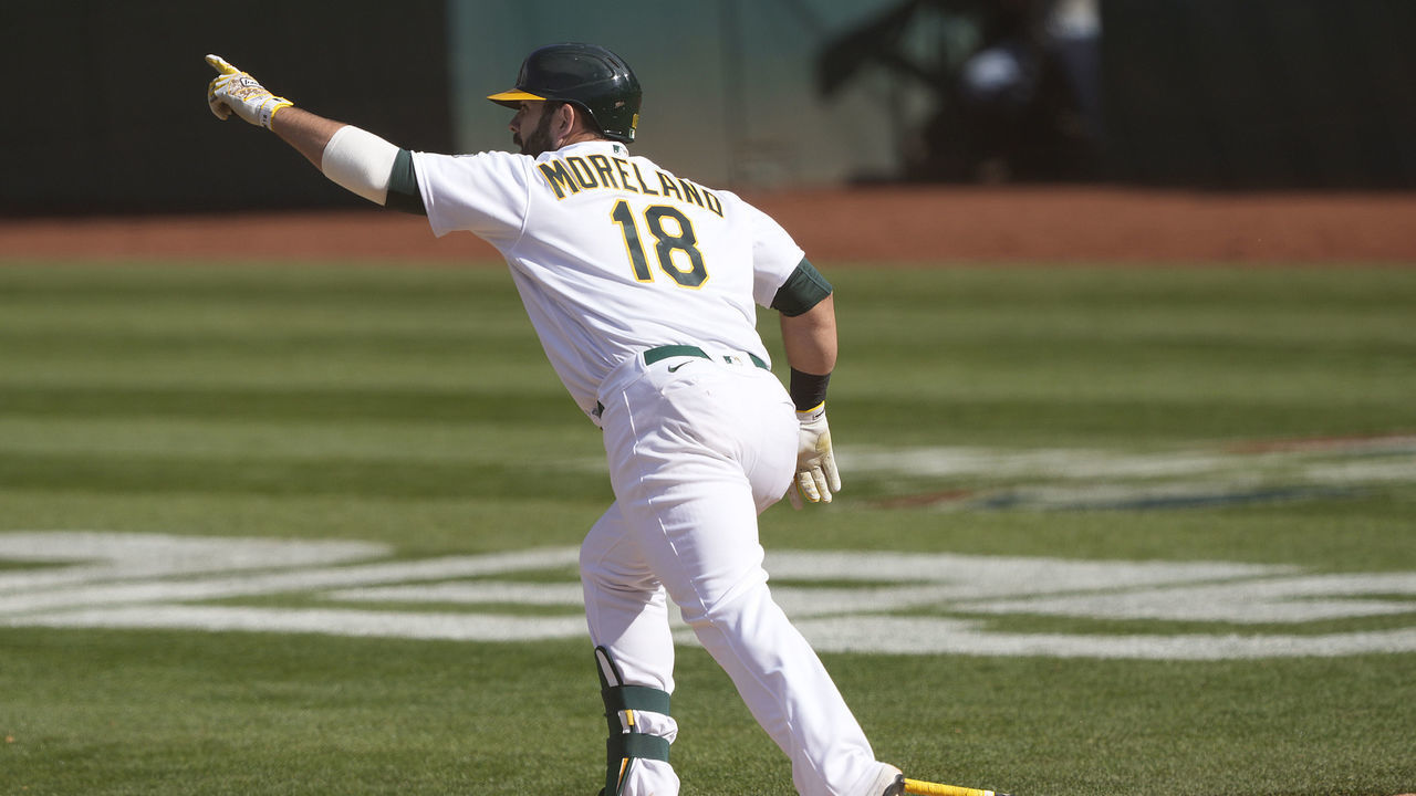OAKLAND, CALIFORNIA - APRIL 07: Mitch Moreland #18 of the Oakland Athletics celebrates his RBI walk-off single to score Mark Canha #20 for a 4-3 win over the Los Angeles Dodgers in 10 innings at RingCentral Coliseum on April 07, 2021 in Oakland, California.
