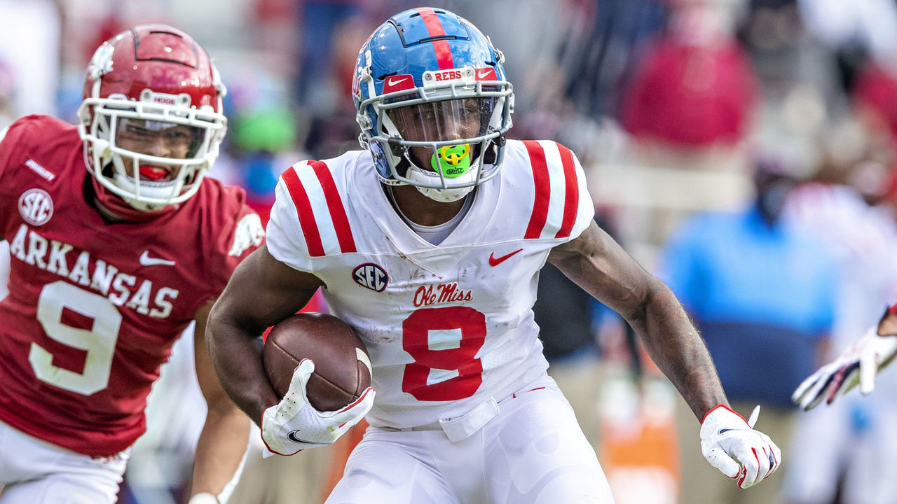 FAYETTEVILLE, AR - OCTOBER 17: Elijah Moore #8 of the Mississippi Rebels runs past Greg Brooks Jr. #9 of the Arkansas Razorbacks at Razorback Stadium on October 17, 2020 in Fayetteville, Arkansas. The Razorbacks defeated the Rebels 33-21.