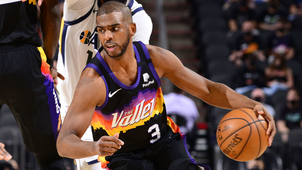 PHOENIX, AZ - APRIL 7: Chris Paul #3 of the Phoenix Suns dribbles the ball during the game against the Utah Jazz on April 7, 2021 at Phoenix Suns Arena in Phoenix, Arizona. Mandatory Copyright Notice: Copyright 2021 NBAE