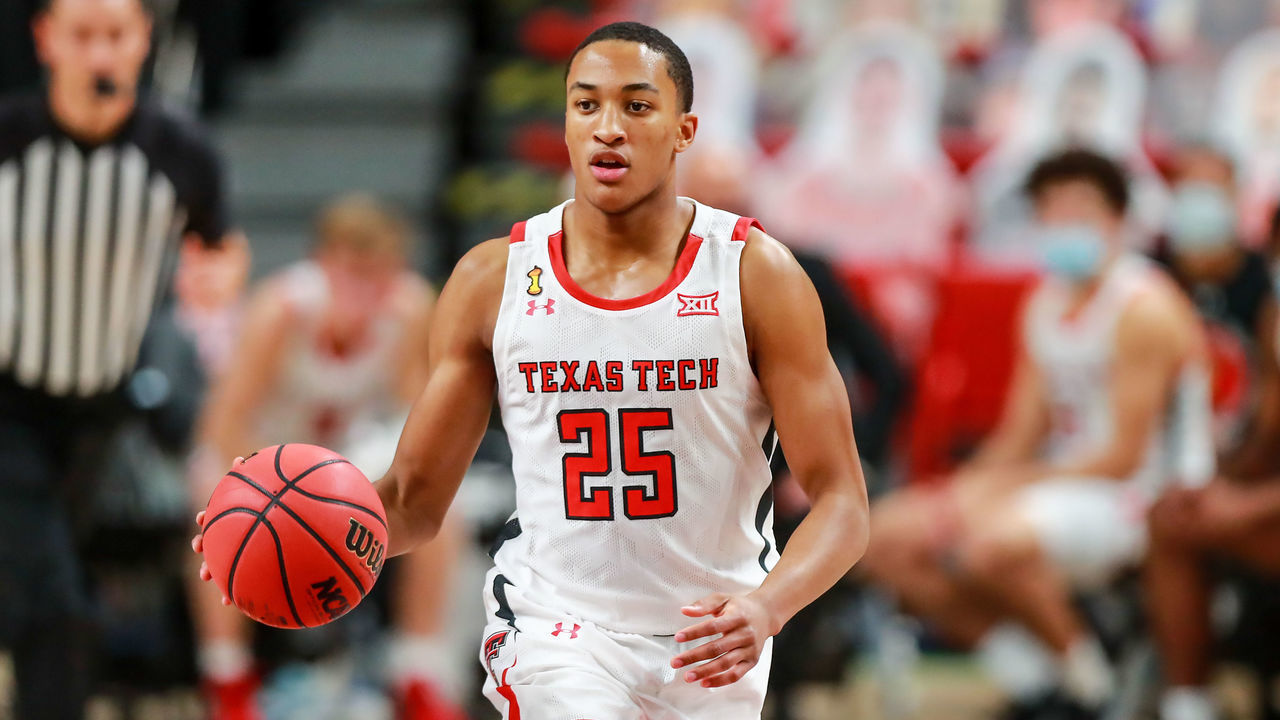 LUBBOCK, TEXAS - NOVEMBER 25: Guard Nimari Burnett #25 of the Texas Tech Red Raiders handles the ball during the first half of the college basketball game against the Northwestern State Demons at United Supermarkets Arena on November 25, 2020 in Lubbock, Texas.