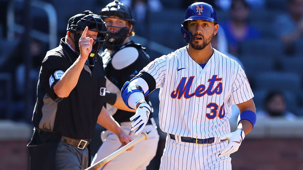 NEW YORK, NEW YORK - APRIL 08: Michael Conforto #30 of the New York Mets celebrates after being hit by a pitch with the bases loaded to force in the winning run in the bottom of the ninth inning against the Miami Marlins at Citi Field on April 08, 2021 in New York City.