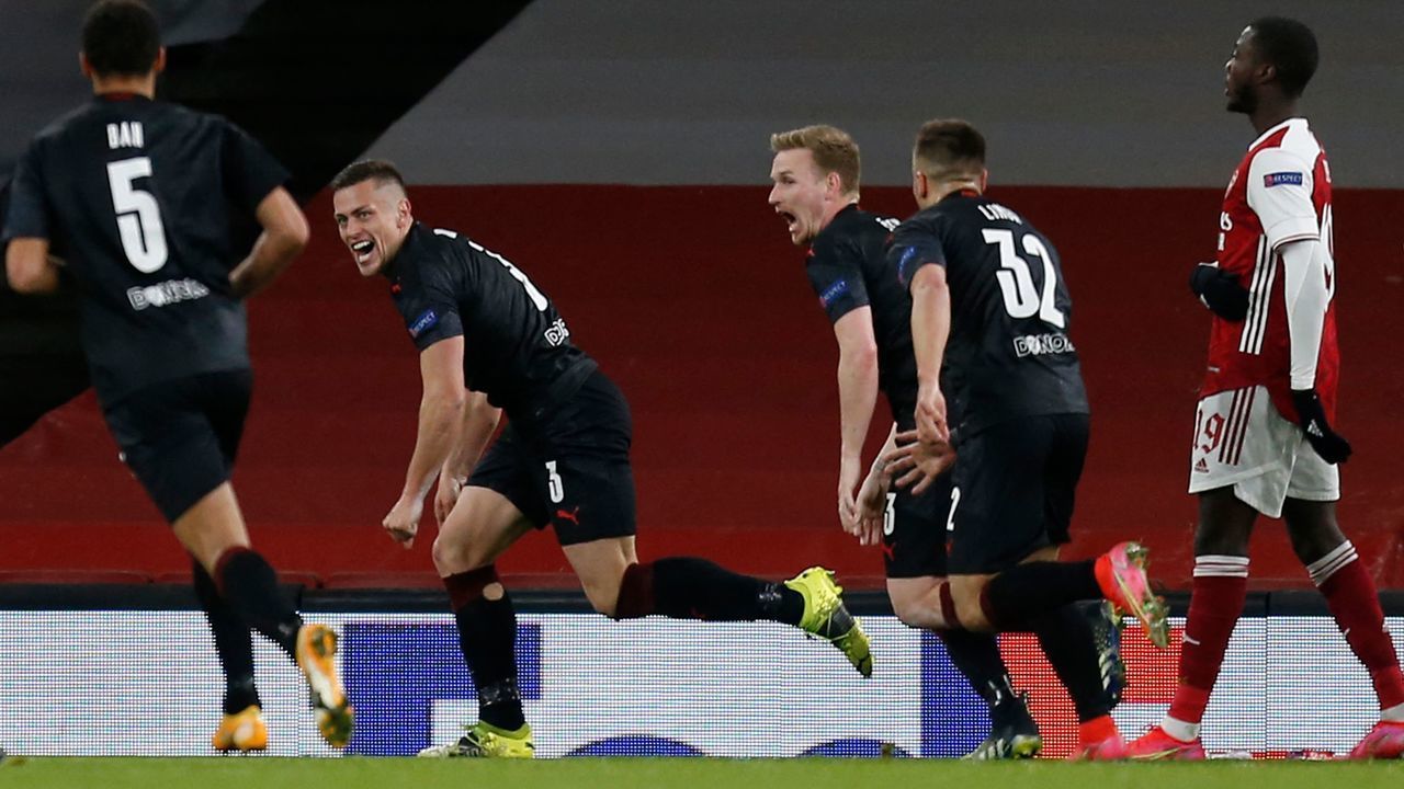Slavia Prague's Czech defender Tomas Holes (2L) celebrates scoring the equalising goal to make the score 1-1 during the UEFA Europa League quarter-final first leg football match between Arsenal and Slavia Prague at the Emirates Stadium in London on April 8, 2021.