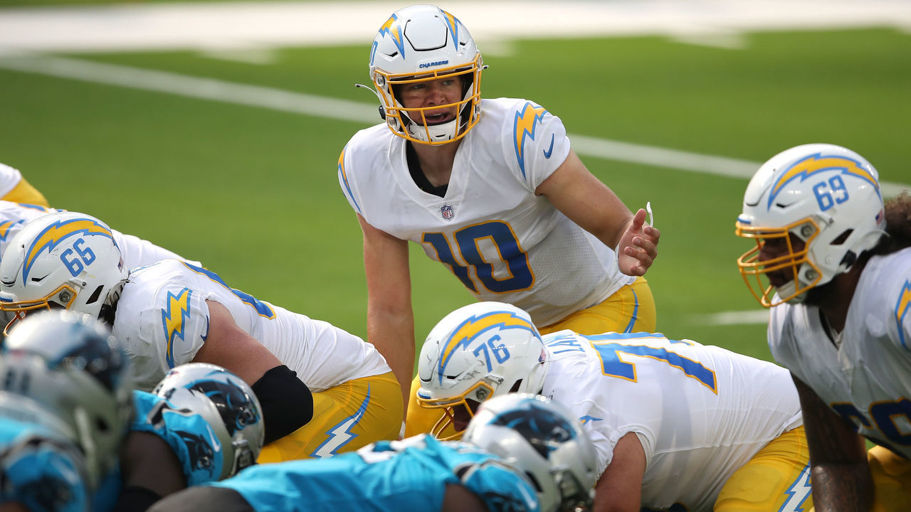 INGLEWOOD, CALIFORNIA - SEPTEMBER 27: Justin Herbert #10 of the Los Angeles Chargers calls a play at the line of scrimmage during the first half of a game against the Carolina Panthers at SoFi Stadium on September 27, 2020 in Inglewood, California.