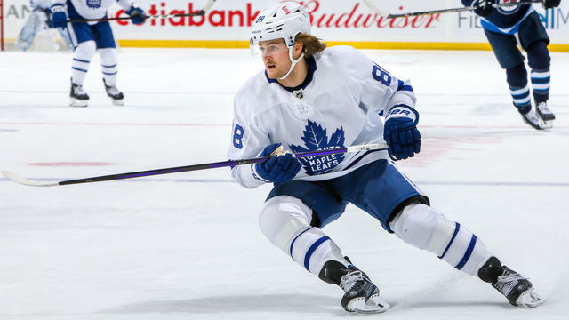 WINNIPEG, MB - APRIL 02: William Nylander #88 of the Toronto Maple Leafs keeps an eye on the play during first period action against the Winnipeg Jets at Bell MTS Place on April 02, 2021 in Winnipeg, Manitoba.