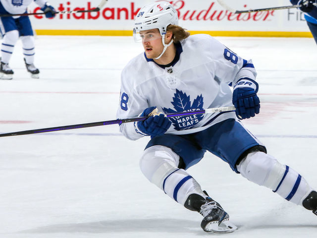 WINNIPEG, MB - APRIL 02: William Nylander #88 of the Toronto Maple Leafs keeps an eye on the play during first period action against the Winnipeg Jets at Bell MTS Place on April 02, 2021 in Winnipeg, Manitoba.