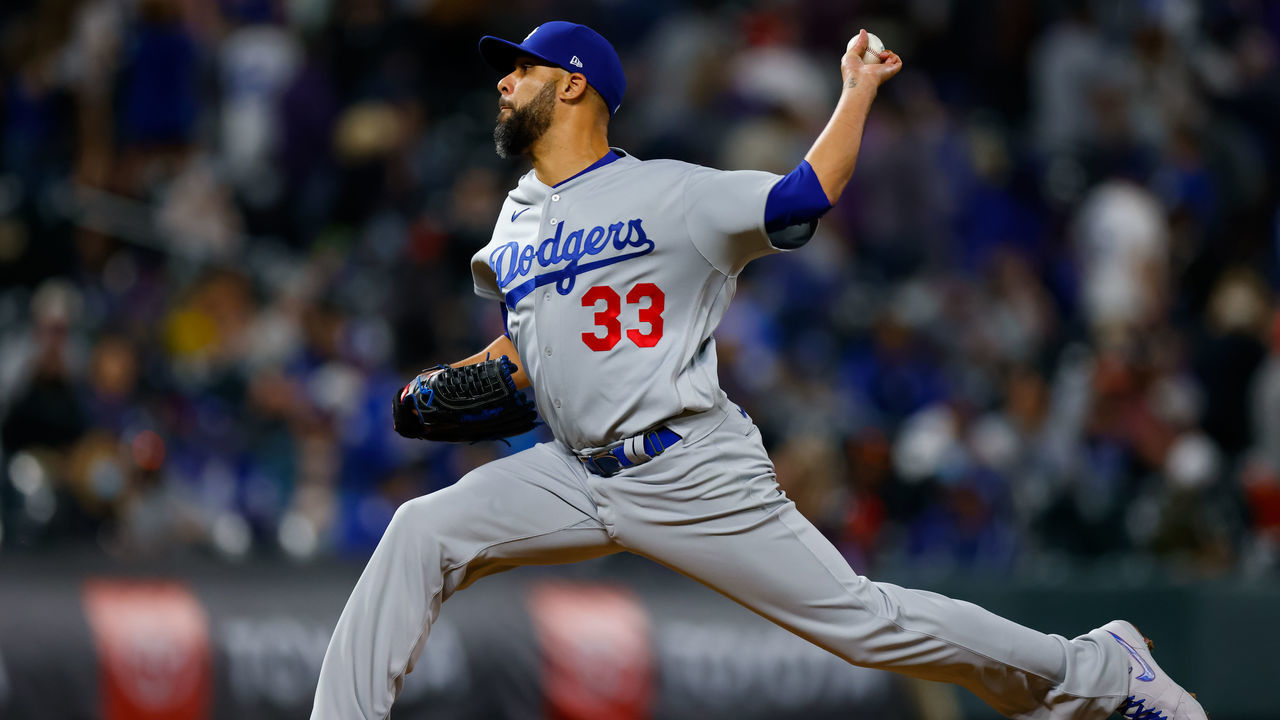 DENVER, CO - APRIL 2: Relief pitcher David Price #33 of the Los Angeles Dodgers delivers to home plate during the seventh inning against the Colorado Rockies at Coors Field on April 2, 2021 in Denver, Colorado.