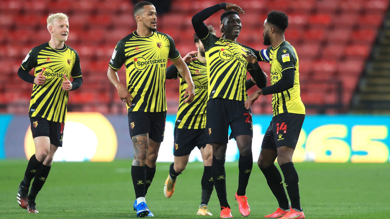 Watford's Ismaila Sarr (second right) celebrates scoring their first goal of the game with teammates during the Sky Bet Championship match at Vicarage Road, Watford. Picture date: Friday April 9, 2021.