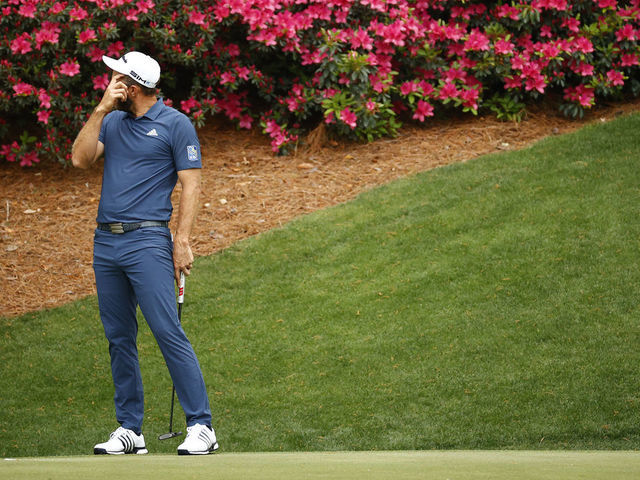 AUGUSTA, GEORGIA - APRIL 09: Dustin Johnson of the United States reacts on the 13th green during the second round of the Masters at Augusta National Golf Club on April 09, 2021 in Augusta, Georgia.