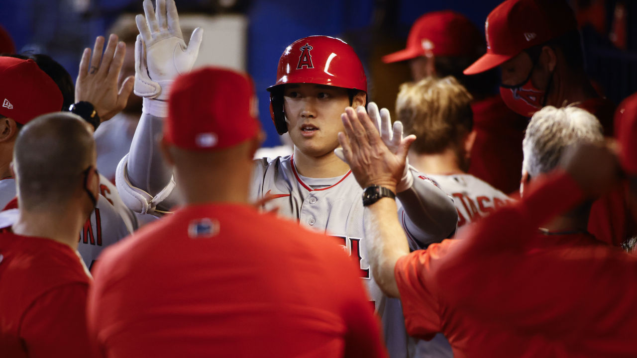 DUNEDIN, FLORIDA - APRIL 09: Shohei Ohtani #17 of the Los Angeles Angels celebrates with his teammates in the dugout after hitting a solo home run to center field during the fifth inning against the Toronto Blue Jays at TD Ballpark on April 09, 2021 in Dunedin, Florida.
