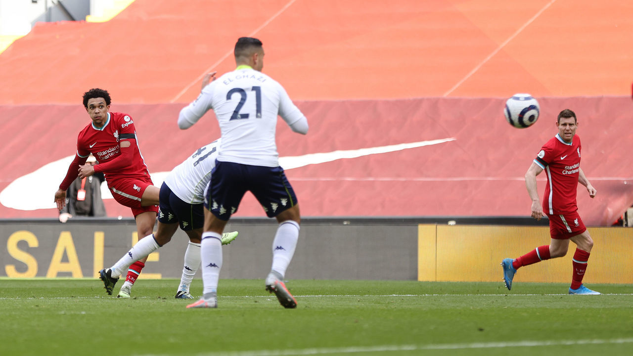 LIVERPOOL, ENGLAND - APRIL 10: Trent Alexander-Arnold of Liverpool scores their team's second goal during the Premier League match between Liverpool and Aston Villa at Anfield on April 10, 2021 in Liverpool, England. Sporting stadiums around the UK remain under strict restrictions due to the Coronavirus Pandemic as Government social distancing laws prohibit fans inside venues resulting in games being played behind closed doors.