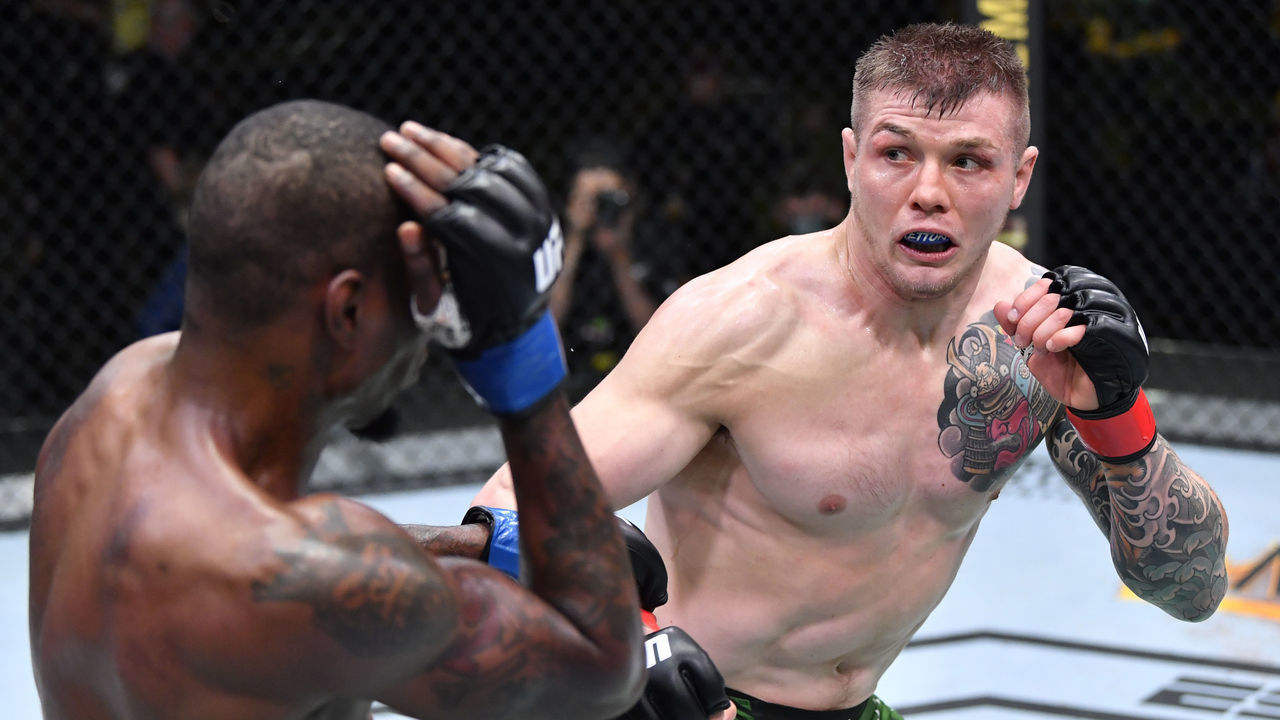 LAS VEGAS, NEVADA - APRIL 10: (R-L) Marvin Vettori of Italy battles Kevin Holland in a middleweight fight during the UFC Fight Night event at UFC APEX on April 10, 2021 in Las Vegas, Nevada.