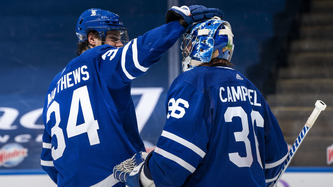 TORONTO, ON - APRIL 10: Jack Campbell #36 of the Toronto Maple Leafs celebrates with teammate Auston Matthews #34 after defeating the Ottawa Senators at the Scotiabank Arena on April 10, 2021 in Toronto, Ontario, Canada.