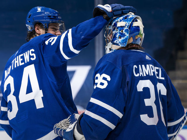 TORONTO, ON - APRIL 10: Jack Campbell #36 of the Toronto Maple Leafs celebrates with teammate Auston Matthews #34 after defeating the Ottawa Senators at the Scotiabank Arena on April 10, 2021 in Toronto, Ontario, Canada.