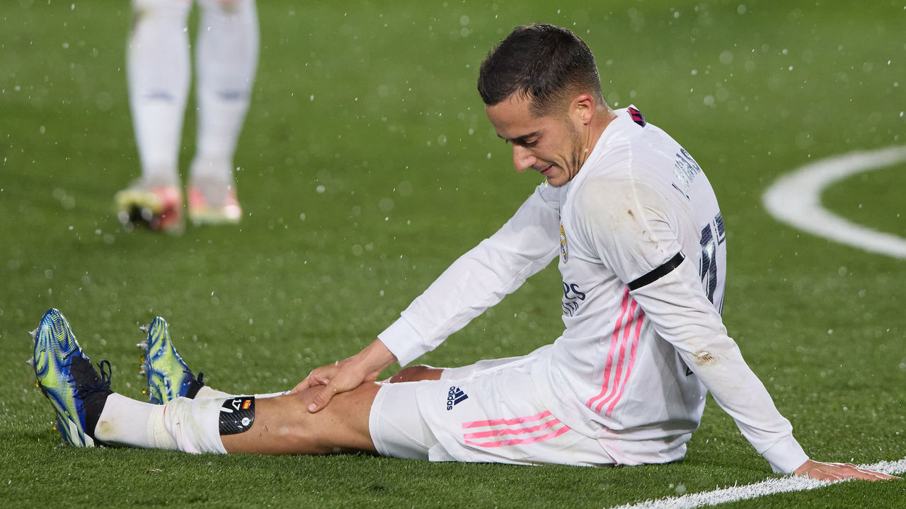 MADRID, SPAIN - APRIL 10: Lucas Vazquez of Real Madrid sits injured on the pitch during the La Liga Santander match between Real Madrid and FC Barcelona at Estadio Alfredo Di Stefano on April 10, 2021 in Madrid, Spain. Sporting stadiums around Spain remain under strict restrictions due to the Coronavirus Pandemic as Government social distancing laws prohibit fans inside venues resulting in games being played behind closed doors.