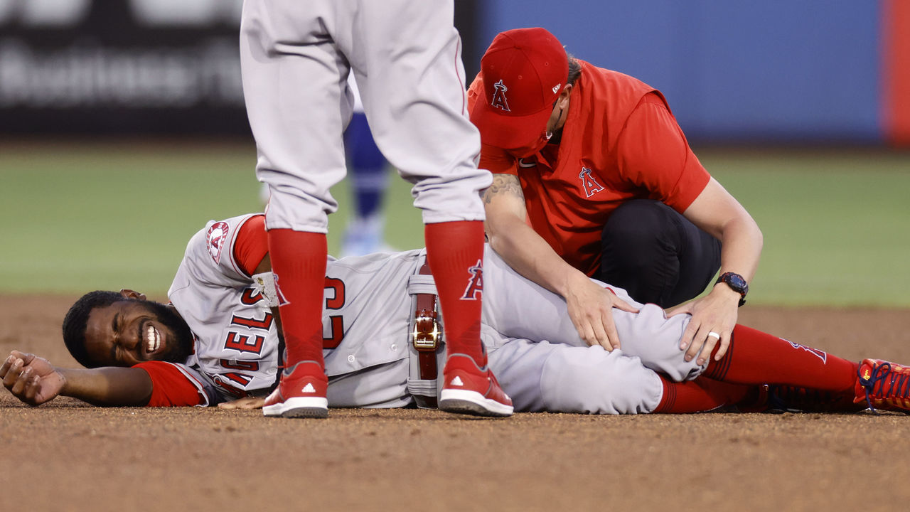 DUNEDIN, FLORIDA - APRIL 09: Dexter Fowler #25 of the Los Angeles Angels reacts after being injured while sliding into second base during the second inning against the Toronto Blue Jays at TD Ballpark on April 09, 2021 in Dunedin, Florida.