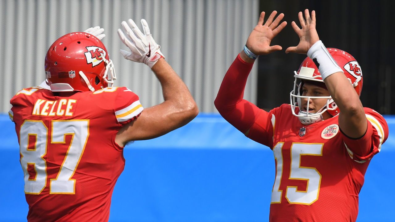 INGLEWOOD, CALIFORNIA - SEPTEMBER 20: Quarterback Patrick Mahomes #15 of the Kansas City Chiefs celebrates a touchdown by teammate tight end Travis Kelce #87 against the Los Angeles Chargers during the second quarter at SoFi Stadium on September 20, 2020 in Inglewood, California.