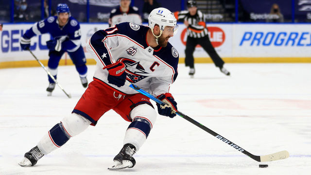 TAMPA, FLORIDA - APRIL 01: Nick Foligno #71 of the Columbus Blue Jackets looks to pass during a game against the Tampa Bay Lightning at Amalie Arena on April 01, 2021 in Tampa, Florida.