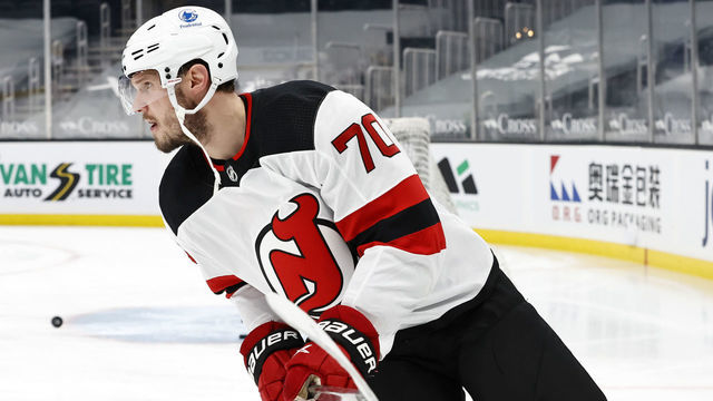 BOSTON, MA - MARCH 28: New Jersey Devils defenseman Dmitry Kulikov (70) skates in warm up before a game between the Boston Bruins and the New Jersey Devils on March 28, 2021, at TD Garden in Boston, Massachusetts.