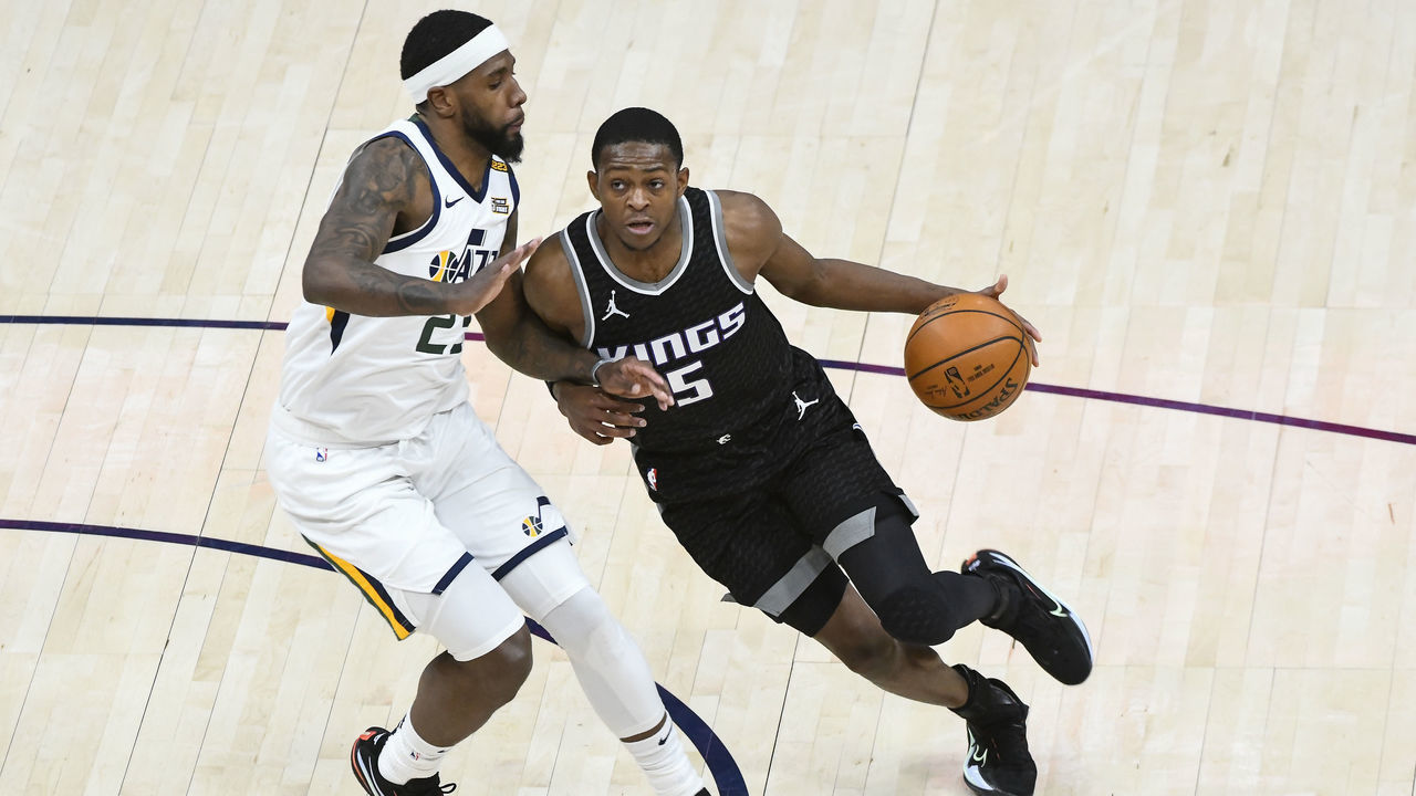 SALT LAKE CITY, UTAH - APRIL 10: De'Aaron Fox #5 of the Sacramento Kings drives around Royce O'Neale #23 of the Utah Jazz during a game at Vivint Smart Home Arena on April 10, 2021 in Salt Lake City, Utah. NOTE TO USER: User expressly acknowledges and agrees that, by downloading and/or using this photograph, user is consenting to the terms and conditions of the Getty Images License Agreement.