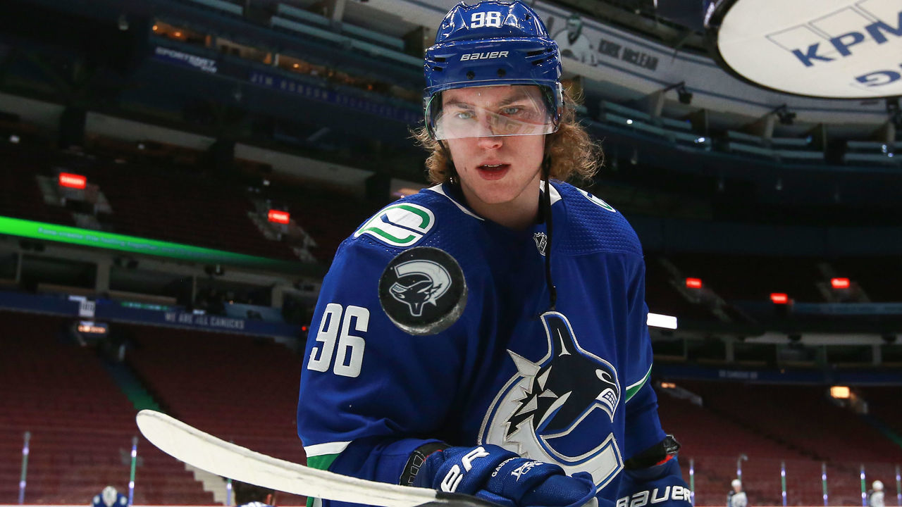 VANCOUVER, BC - MARCH 24: Vancouver Canucks Center Adam Gaudette (96) bounces a puck on his stick while warming up before playing the Winnipeg Jets during their NHL game at Rogers Arena on March 24, 2021 in Vancouver, British Columbia, Canada.