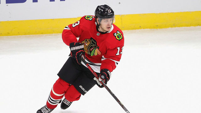 CHICAGO, ILLINOIS - FEBRUARY 02: Mattias Janmark #13 of the Chicago Blackhawks controls the puck against the Carolina Hurricanes at the United Center on February 02, 2021 in Chicago, Illinois. The Hurricanes defeated the Blackhawks 4-3 in a shootout.