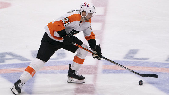 UNIONDALE, NY - MARCH 20: Philadelphia Flyers Center Scott Laughton (21) controls the puck during the second period of the game between the Philadelphia Flyers and the New York Islanders on March 20, 2021, at thee Nassau Veterans Memorial Coliseum in Uniondale, NY.