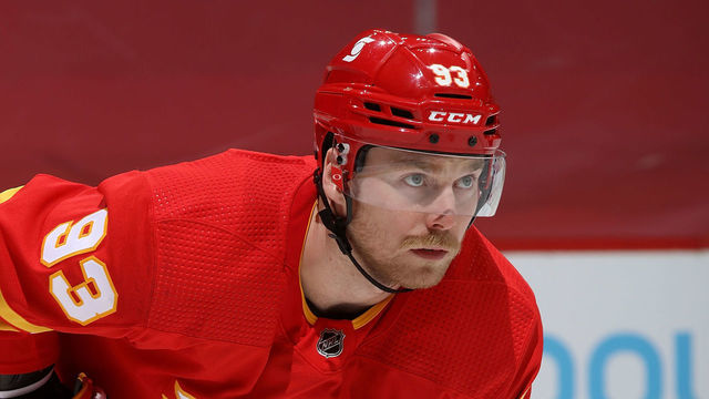 CALGARY, AB - MARCH 29: Sam Bennett #93 of the Calgary Flames prepares to face off against the Winnipeg Jets at Scotiabank Saddledome on March 29, 2021 in Calgary, Alberta, Canada.