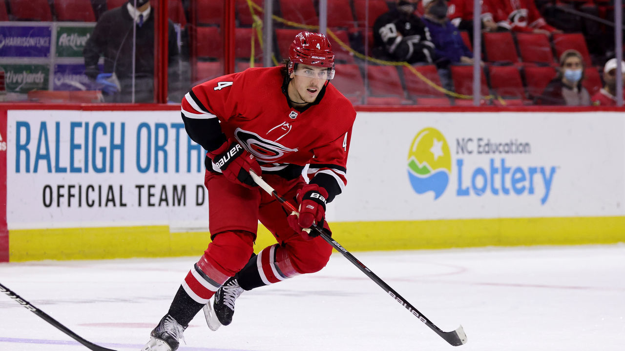 RALEIGH, NC - APRIL 4: Haydn Fleury #4 of the Carolina Hurricanes skates for position on the ice during an NHL game against the Dallas Stars on April 4, 2021 at PNC Arena in Raleigh, North Carolina.