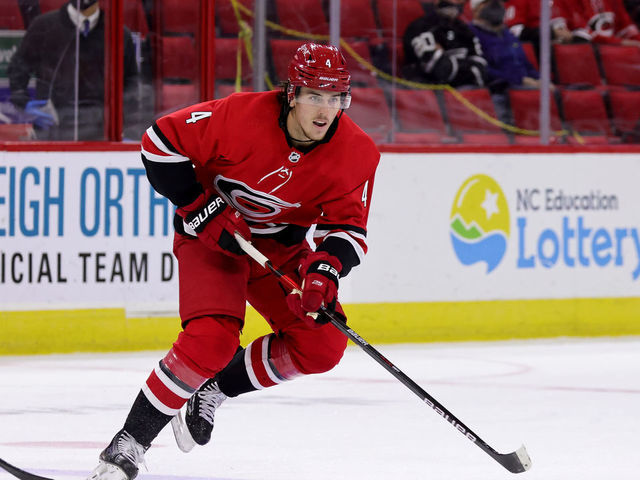 RALEIGH, NC - APRIL 4: Haydn Fleury #4 of the Carolina Hurricanes skates for position on the ice during an NHL game against the Dallas Stars on April 4, 2021 at PNC Arena in Raleigh, North Carolina.