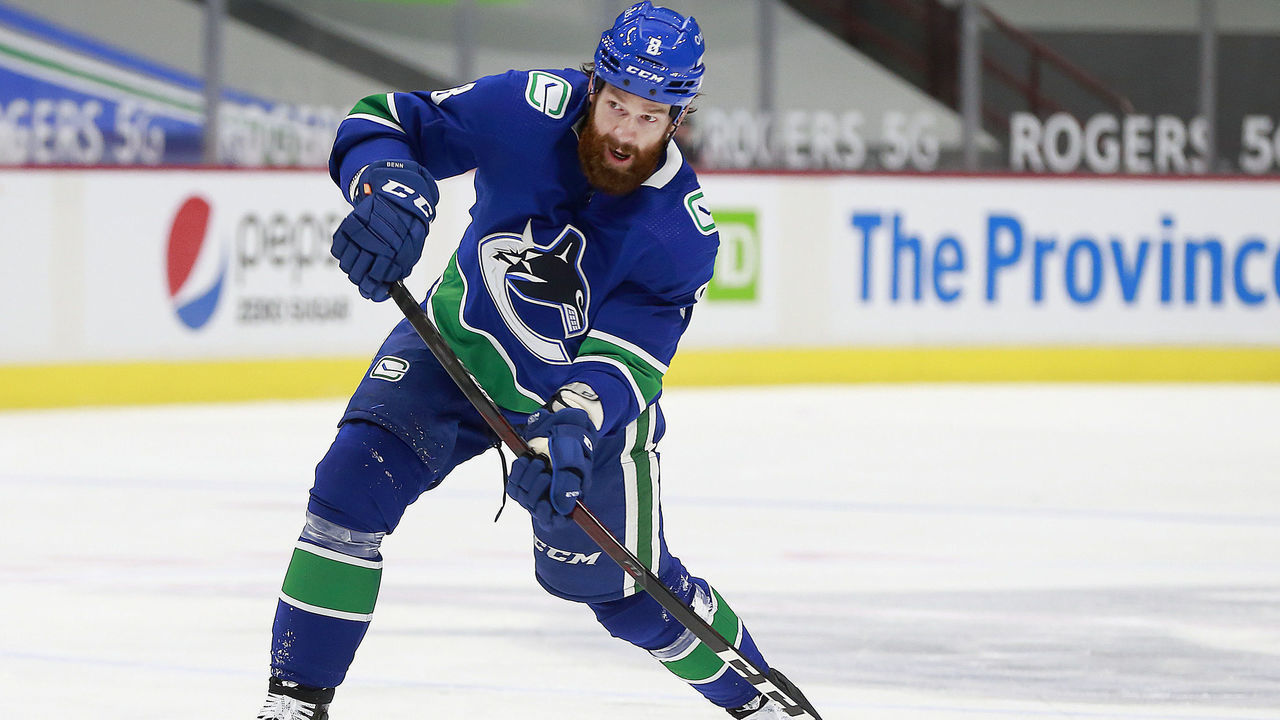 VANCOUVER, BC - MARCH 22: Jordie Benn #8 of the Vancouver Canucks takes a shot during their NHL game against the Winnipeg Jets at Rogers Arena on March 22, 2021 in Vancouver, British Columbia, Canada. "n