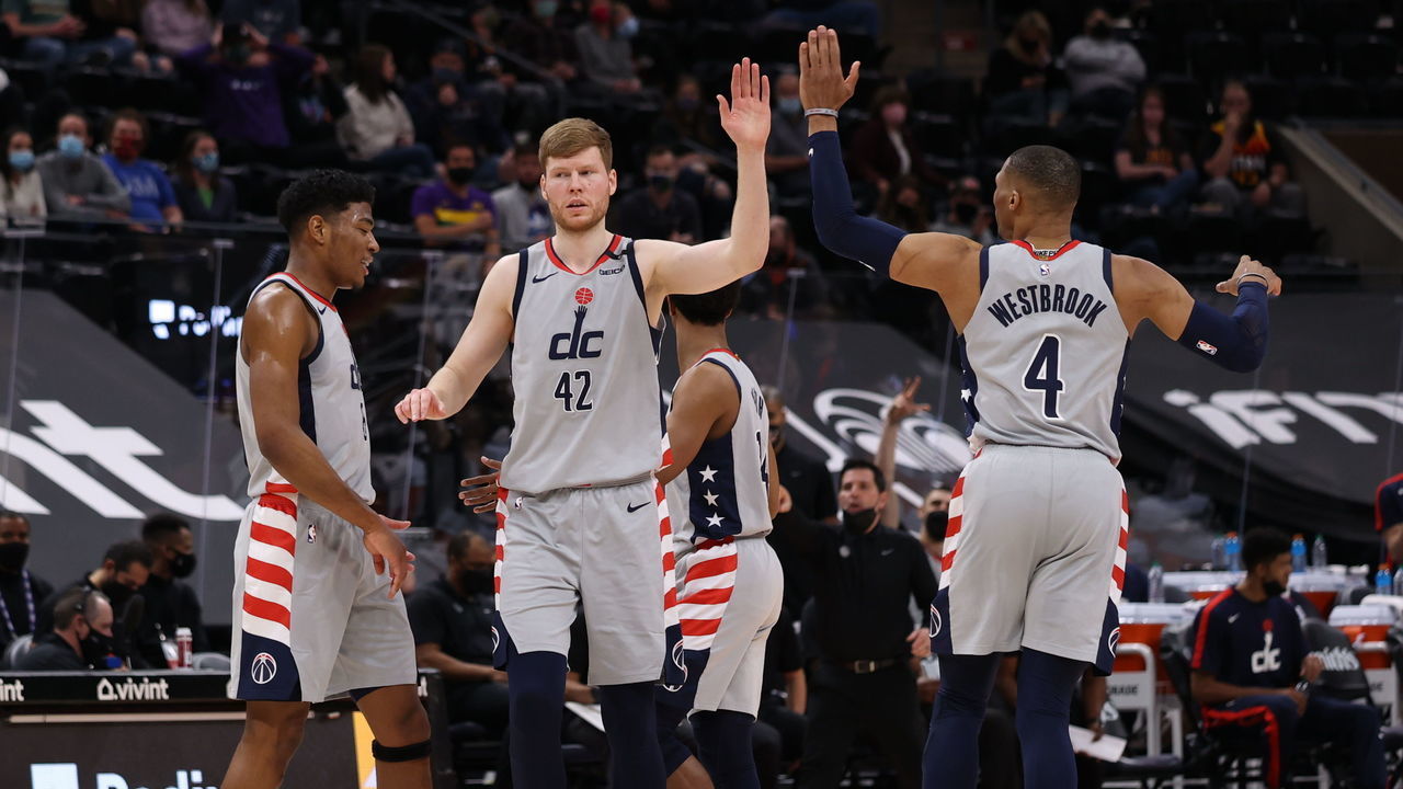 SALT LAKE CITY, UT - APRIL 12: Rui Hachimura #8, Davis Bertans #42, and Russell Westbrook #4 of the Washington Wizards hi-five during the game against the Utah Jazz on April 12, 2021 at vivint.SmartHome Arena in Salt Lake City, Utah. Mandatory Copyright Notice: Copyright 2021 NBAE