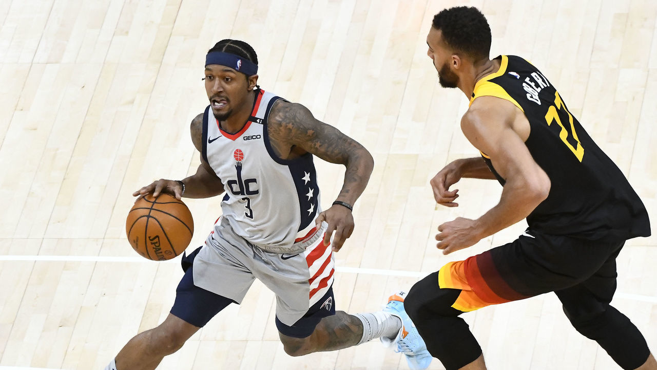 SALT LAKE CITY, UTAH - APRIL 12: Bradley Beal #3 of the Washington Wizards drives past Rudy Gobert #27 of the Utah Jazz during a game at Vivint Smart Home Arena on April 12, 2021 in Salt Lake City, Utah. NOTE TO USER: User expressly acknowledges and agrees that, by downloading and/or using this photograph, user is consenting to the terms and conditions of the Getty Images License Agreement.