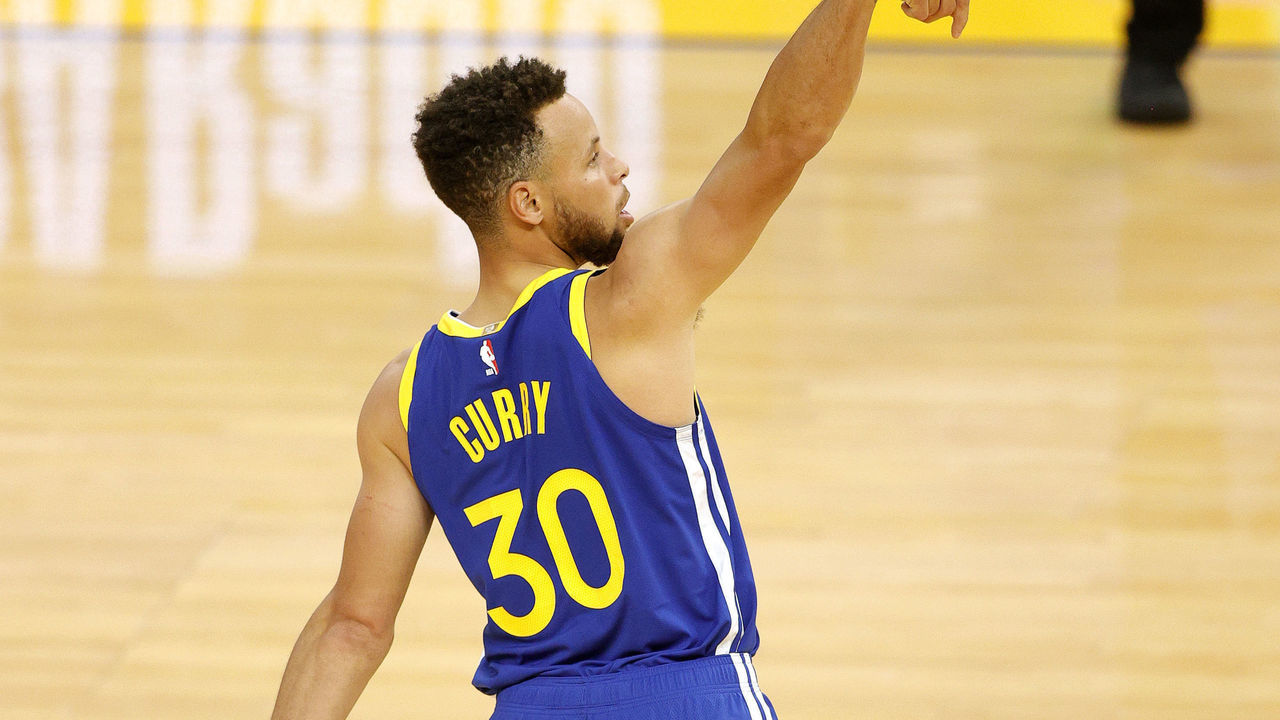 SAN FRANCISCO, CALIFORNIA - APRIL 12: Stephen Curry #30 of the Golden State Warriors watches his shot against the Denver Nuggets at Chase Center on April 12, 2021 in San Francisco, California.