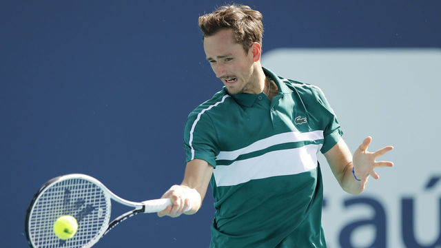 MIAMI GARDENS, FLORIDA - MARCH 30: Daniil Medvedev of Russia returns a shot to Frances Tiafoe of the United States during the Miami Open at Hard Rock Stadium on March 30, 2021 in Miami Gardens, Florida.