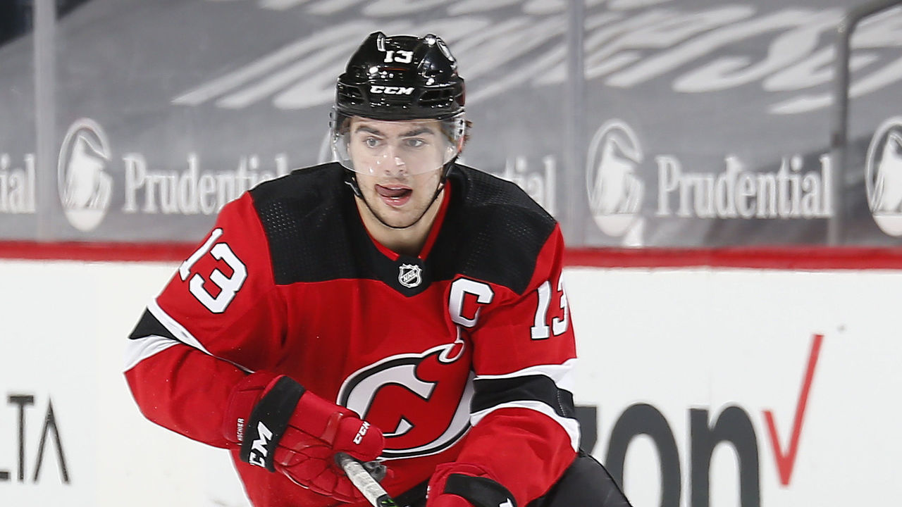 NEWARK, NEW JERSEY - FEBRUARY 27: Nico Hischier #13 of the New Jersey Devils skates with the puck against the Washington Capitals during the third period at Prudential Center on February 27, 2021 in Newark, New Jersey.