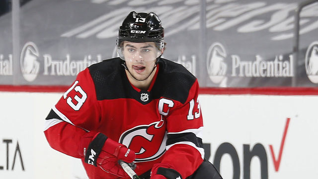 NEWARK, NEW JERSEY - FEBRUARY 27: Nico Hischier #13 of the New Jersey Devils skates with the puck against the Washington Capitals during the third period at Prudential Center on February 27, 2021 in Newark, New Jersey.