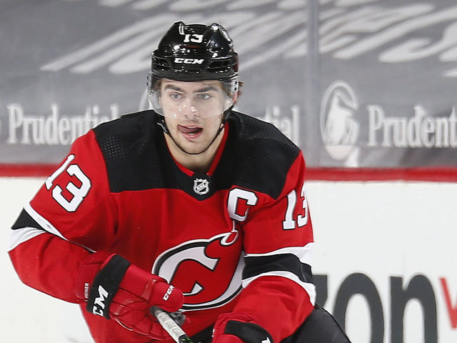 NEWARK, NEW JERSEY - FEBRUARY 27: Nico Hischier #13 of the New Jersey Devils skates with the puck against the Washington Capitals during the third period at Prudential Center on February 27, 2021 in Newark, New Jersey.