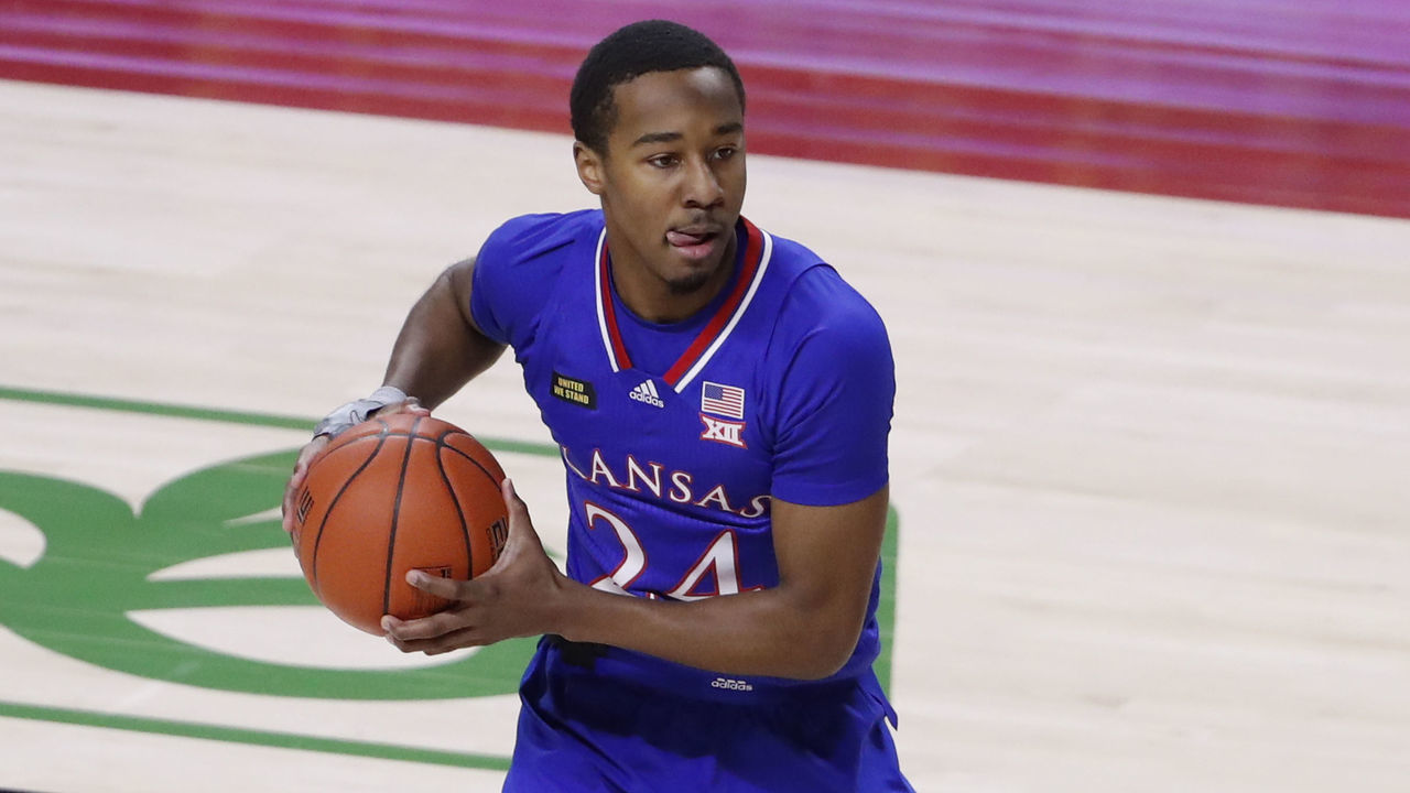 AMES, IA - FEBRUARY 13: Bryce Thompson #24 of the Kansas Jayhawks passes the ball in the first half of play at Hilton Coliseum on February 13, 2021 in Ames, Iowa. The Kansas Jayhawks won 64-50 over the Iowa State Cyclones.