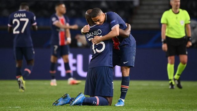 Paris Saint-Germain's Portuguese midfielder Danilo Pereira (L) and Paris Saint-Germain's French defender Colin Dagba celebrate after winning the UEFA Champions League quarter-final second leg football match between Paris Saint-Germain (PSG) and FC Bayern Munich at the Parc des Princes stadium in Paris, on April 13, 2021.